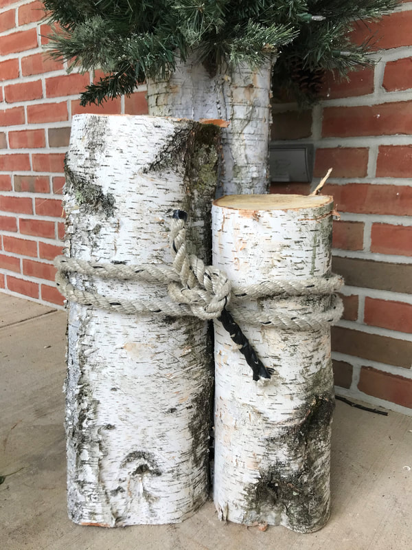 Birch logs make great rustic decorations for porch Crows Nest Arts