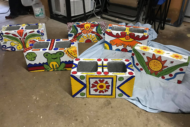 Hand-painted cinder blocks for custom garden makeover by Crows Nest Arts