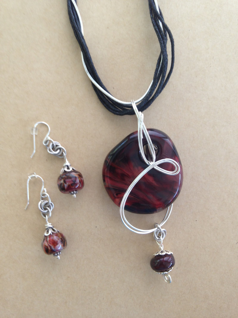 custom pendant and earring set made from beads purchased on a special trip